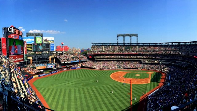 Panoramic image of the Mets stadium in New York, Citi Field, on a sunny blue-skied day