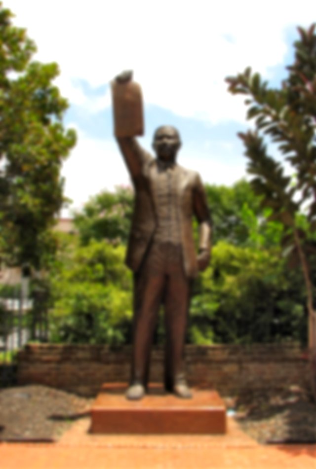 Statue of the Texas State Legislator Al Edwards holding up the 1979 legislation making Juneteenth a paid Texas state holiday