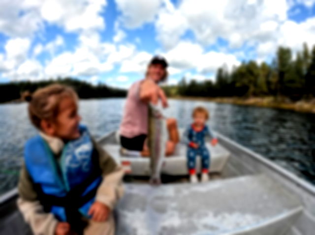 A father and his two children fishing