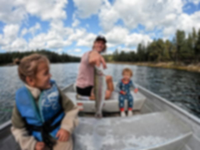 A father and his two children fishing