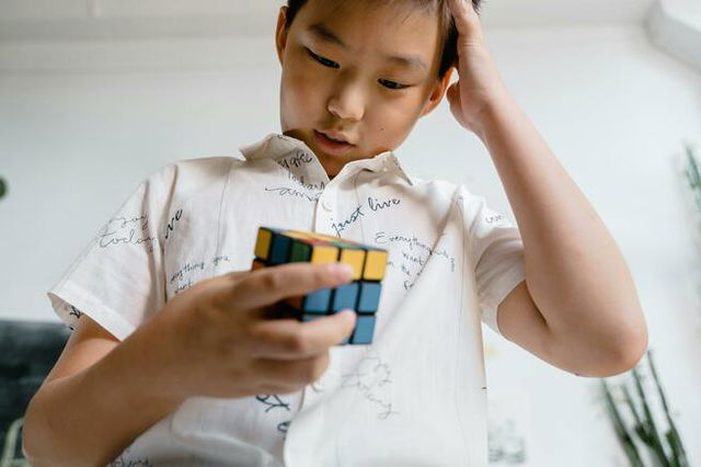 Boy Holding a Rubik‘s Cube