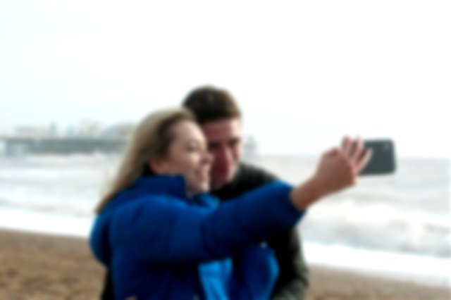 A man and a woman clicking selfie