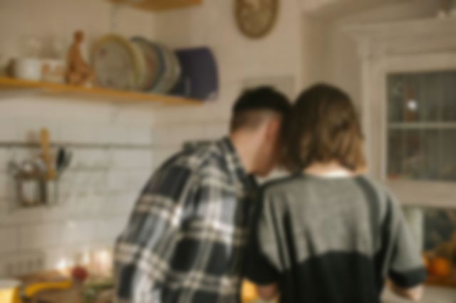 A man and woman in the Kitchen