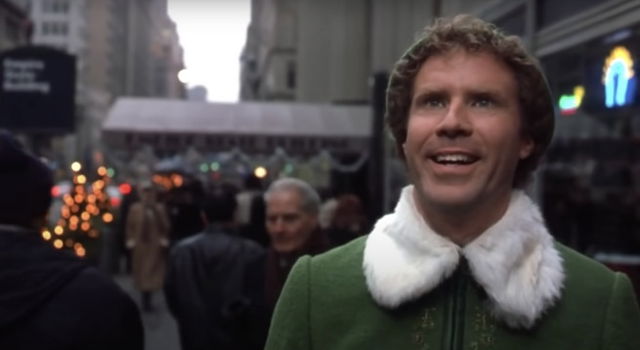 Elf looking in amazement towards a toy shop