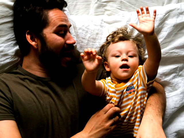 Father and son in bed