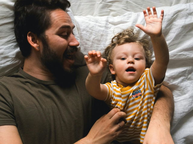 Father and son in bed