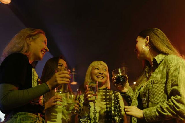 Girls smiling and enjoying drinking