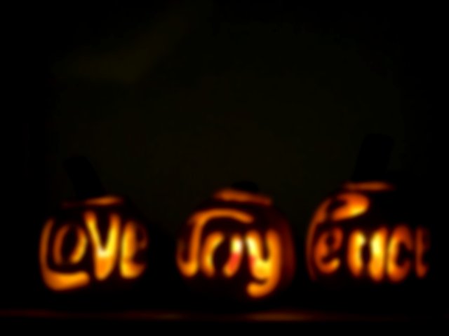 peace, joy and love carved into pumpkins