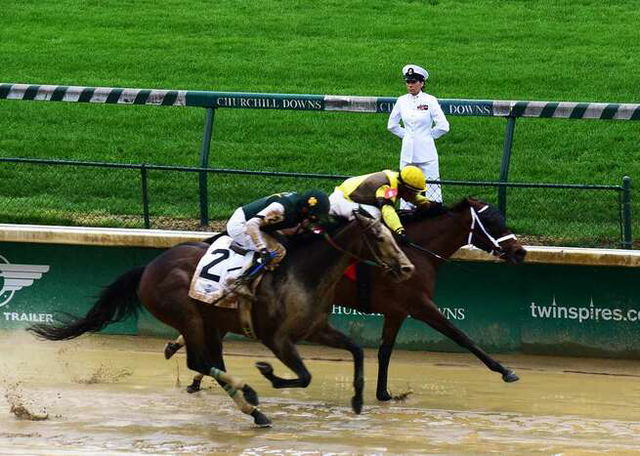 Master Chief Sherri Roberts, assigned to the Navy Operational Support Center (NOSC) Louisville, mans the rails during the 143rd Kentucky Derby at Churchill Downs