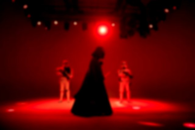 People in Star Wars Characters Costumes Standing on Stage