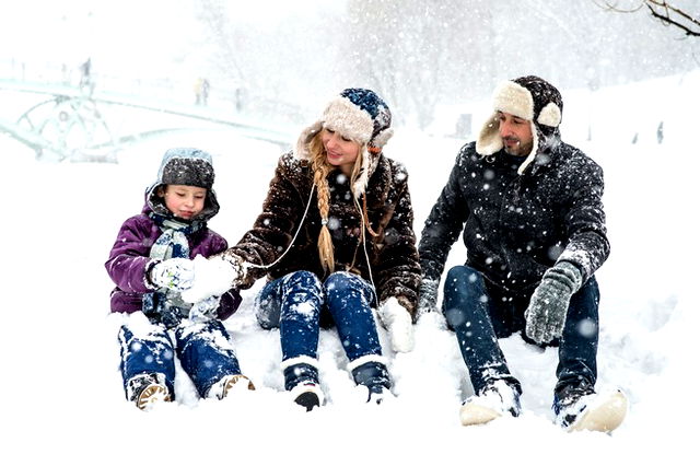 A family enjoying in the snow