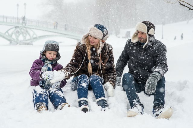 A family enjoying in the snow