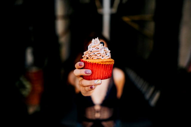 woman holding cupcake