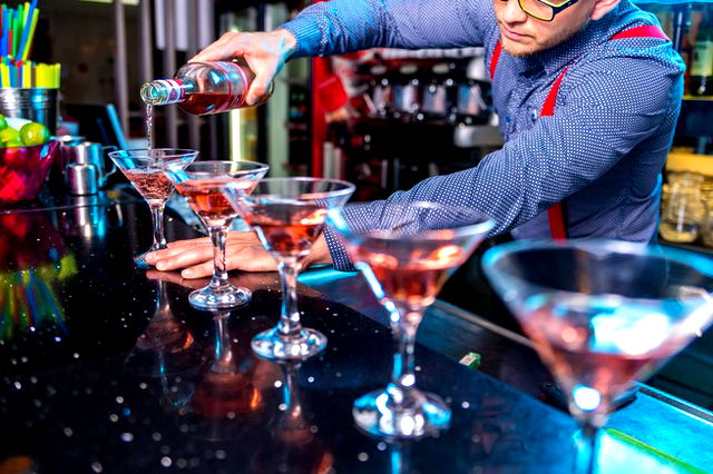 Man Pouring Liqueur On Glass