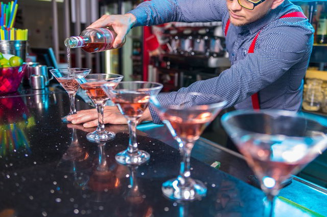 Man Pouring Liqueur On Glass