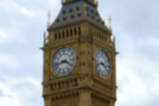 Big Ben in London with a blue sky background.