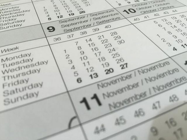 A calendar with the month of November at an angle on a white page