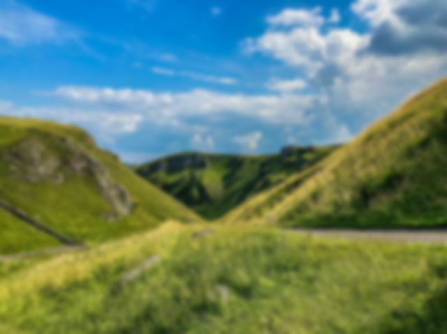 Hills with bright blue skies and a few clouds