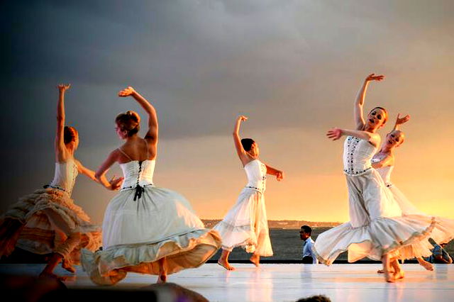 5 Women in White Dress Dancing Under Gray Sky during Sunset