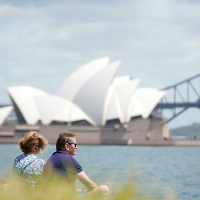 Couple Relaxing by Sydney Opera House View