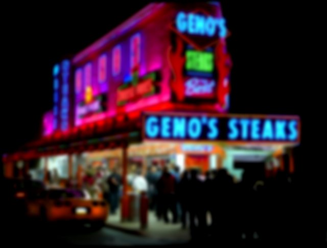 On a dark night, bright neon signs await a queue of people at “Gino's” waiting for their food