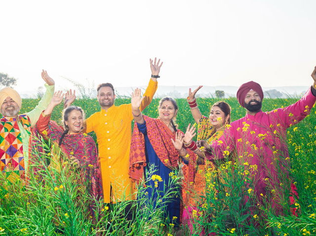 punjabi family doing bhangra during baisakhi