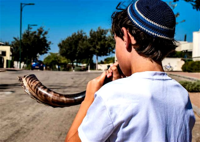 A Jewish Boy playing Shofar