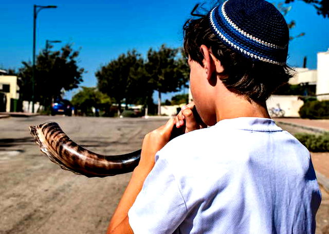 A Jewish Boy playing Shofar