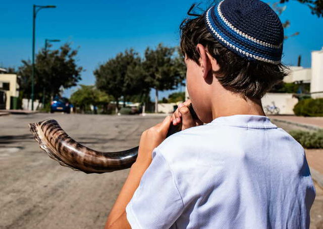 A Jewish Boy playing Shofar