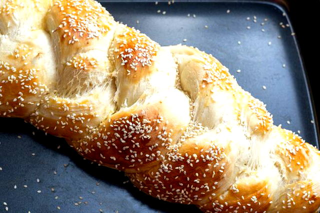 A Sabbath loaf of bread, the challah, on a tray.