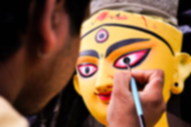 Drawing the eyes of Maa Durga on Mahalaya