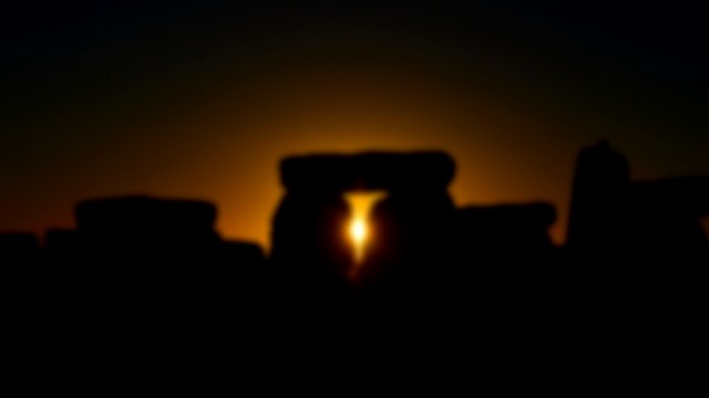 View of the Autumn Equinox Sunrise at against the Silhouette of the Standing Stones at Stonehenge in England