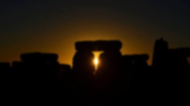 View of the Autumn Equinox Sunrise at against the Silhouette of the Standing Stones at Stonehenge in England