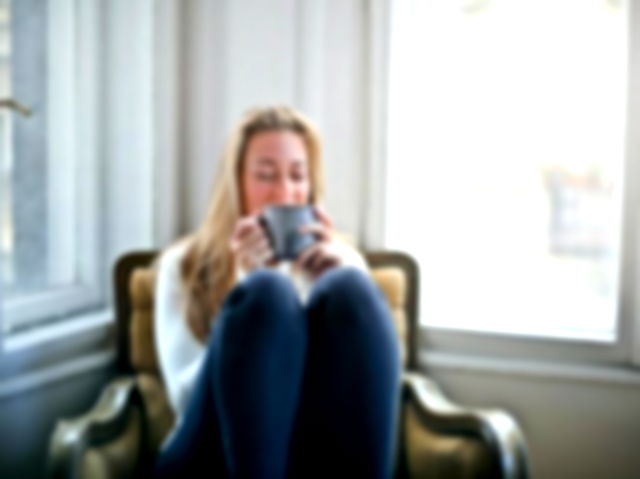 Woman Holding Gray Ceramic Mug