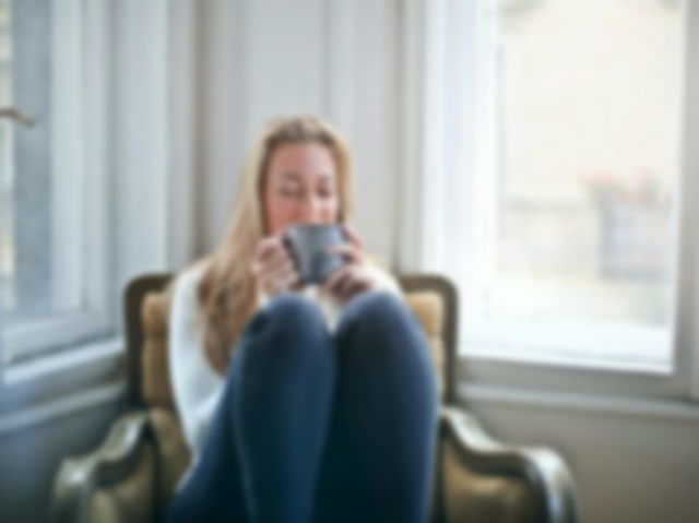 Woman Holding Gray Ceramic Mug