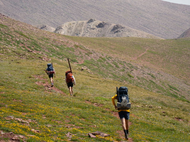 Three men hiking