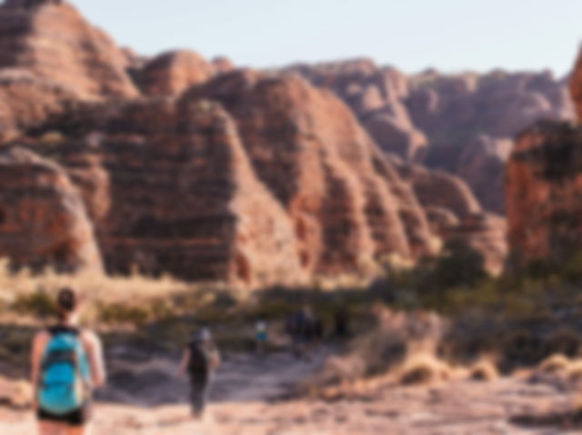 Travelers exploring rocky mountains in picturesque National Park in Australia