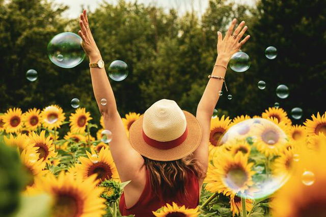 Woman in Sunflower Field