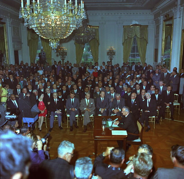 President Lyndon B Johnson signing the Civil Rights Act of 1964