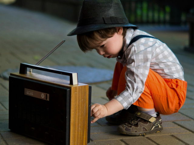 A small boy with radio