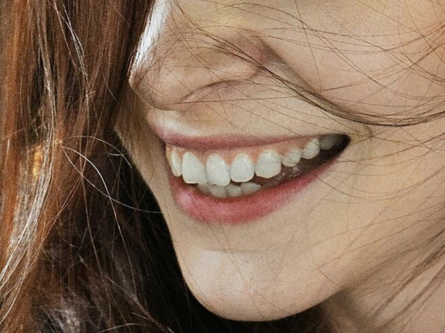 A woman smiling