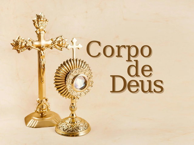 cruz e ostensório dourados em fundo ocre