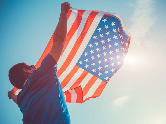 Man waiving the USA national flag