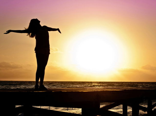 Free woman with open arms