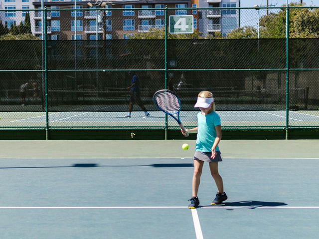 Girl playing Tennis