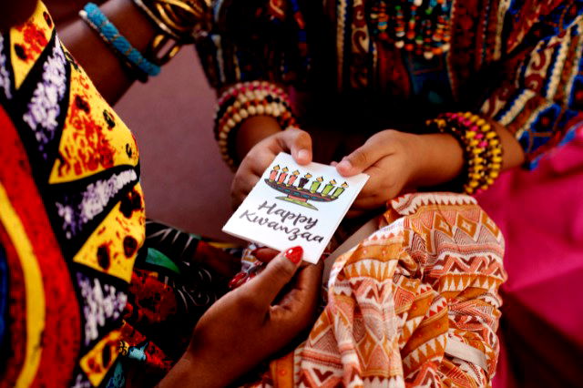 Happy Kwanzaa - exchanging greeting cards.