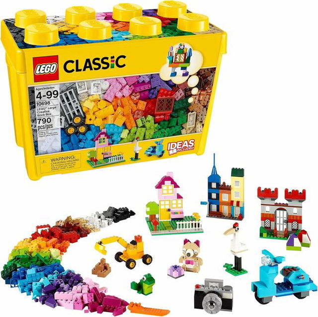 A LEGO Classic large yellow storage box filled with colorful building bricks, shown alongside example builds including houses, vehicles, animals, and small structures made from the assorted pieces.