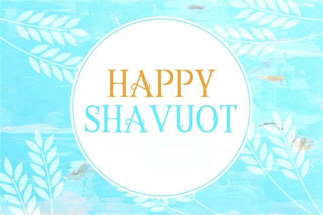 happy shavuot written in a white circle on a light blue background with images of crops patterned around