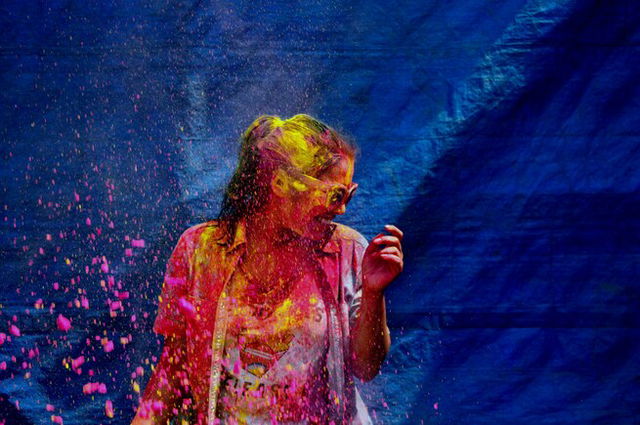 A woman playing Holi