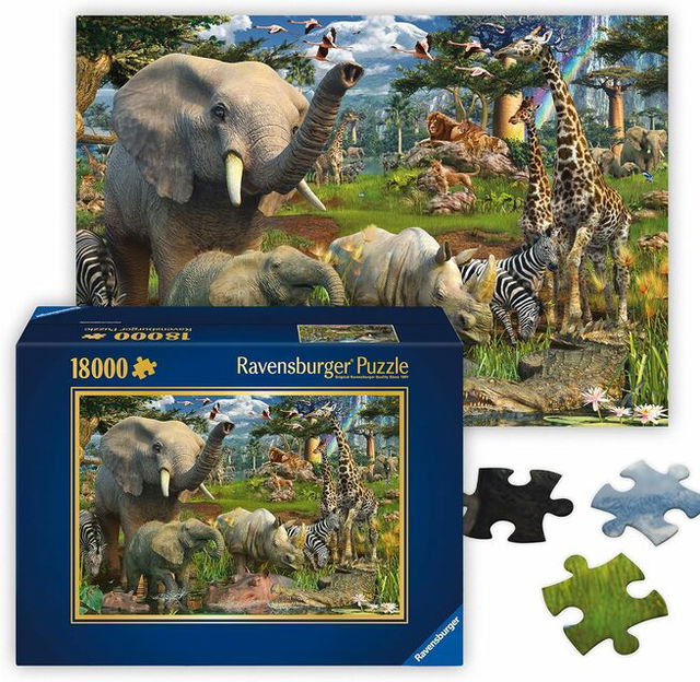 A Ravensburger 18,000-piece jigsaw puzzle featuring a detailed wildlife scene with elephants, giraffes, zebras, rhinos, and birds in a lush forest setting, shown alongside the puzzle box and a few oversized puzzle pieces.